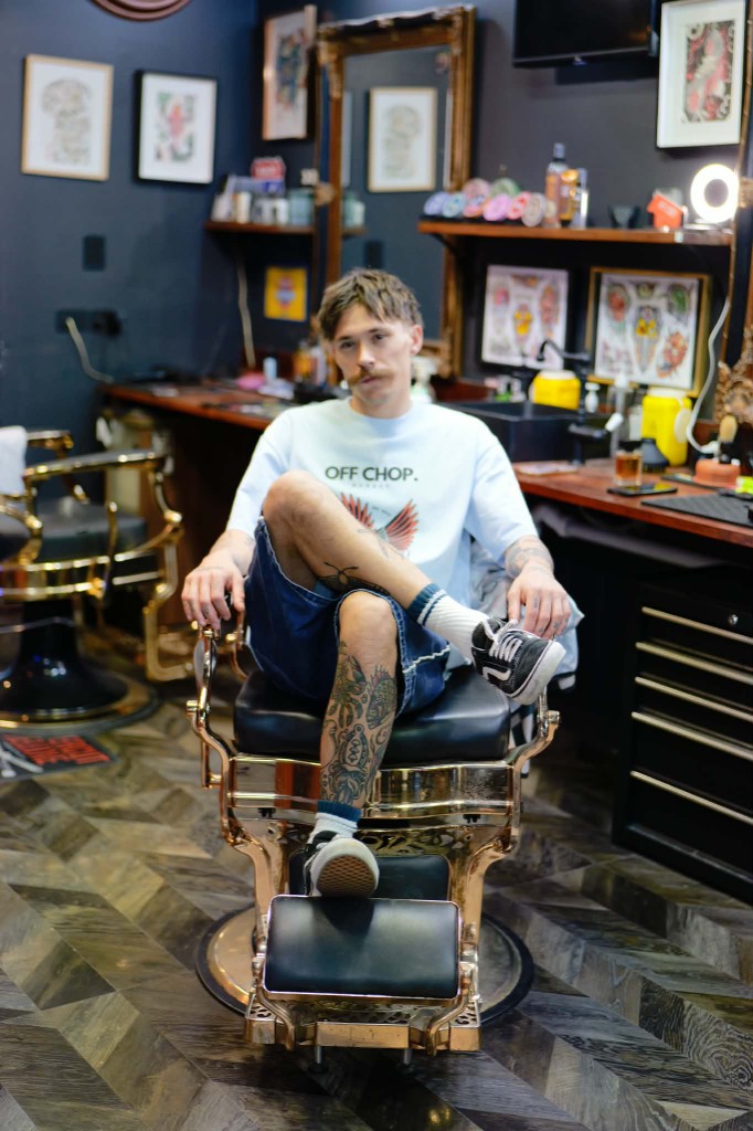Benjamin seated in the barber chair