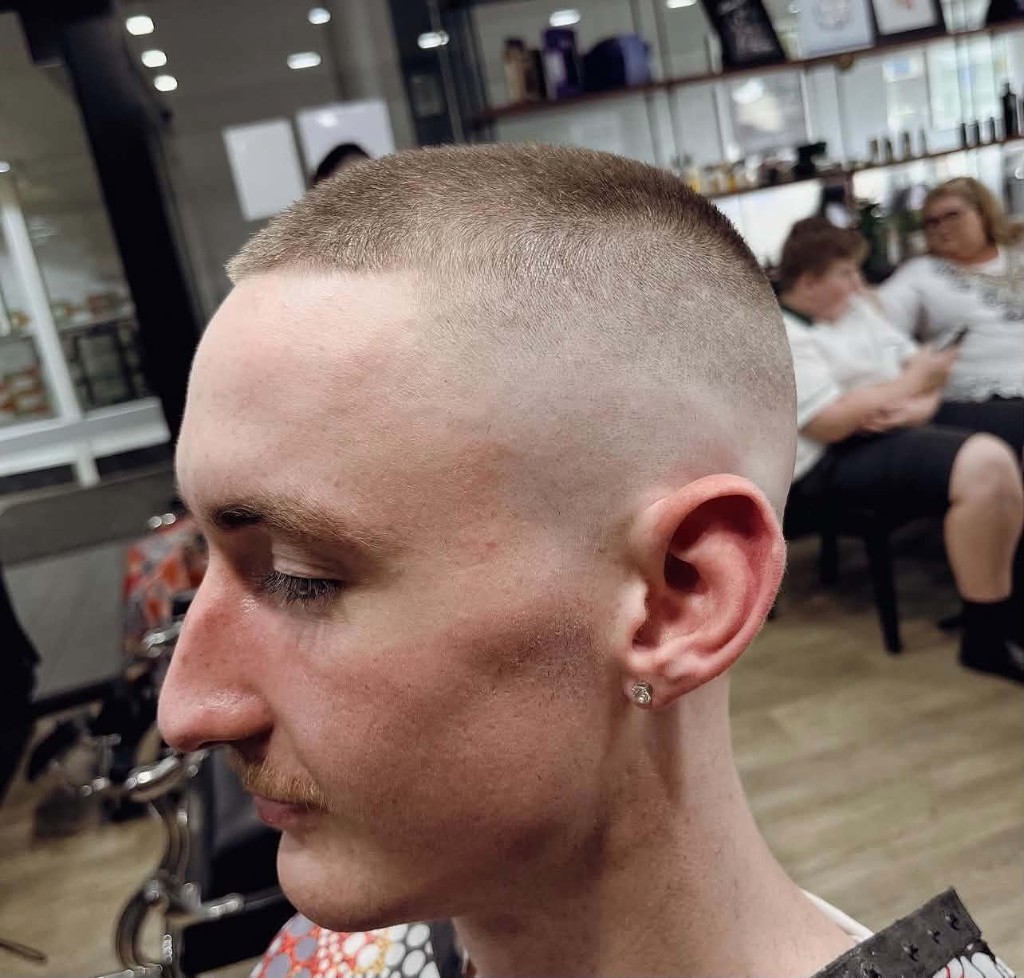 Buzz cut with high skin fade, side profile