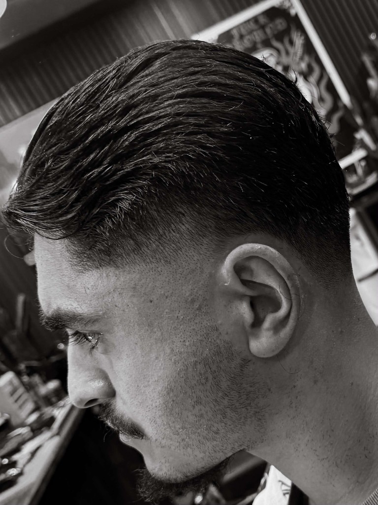 Textured scissor haircut, side profile, black and white