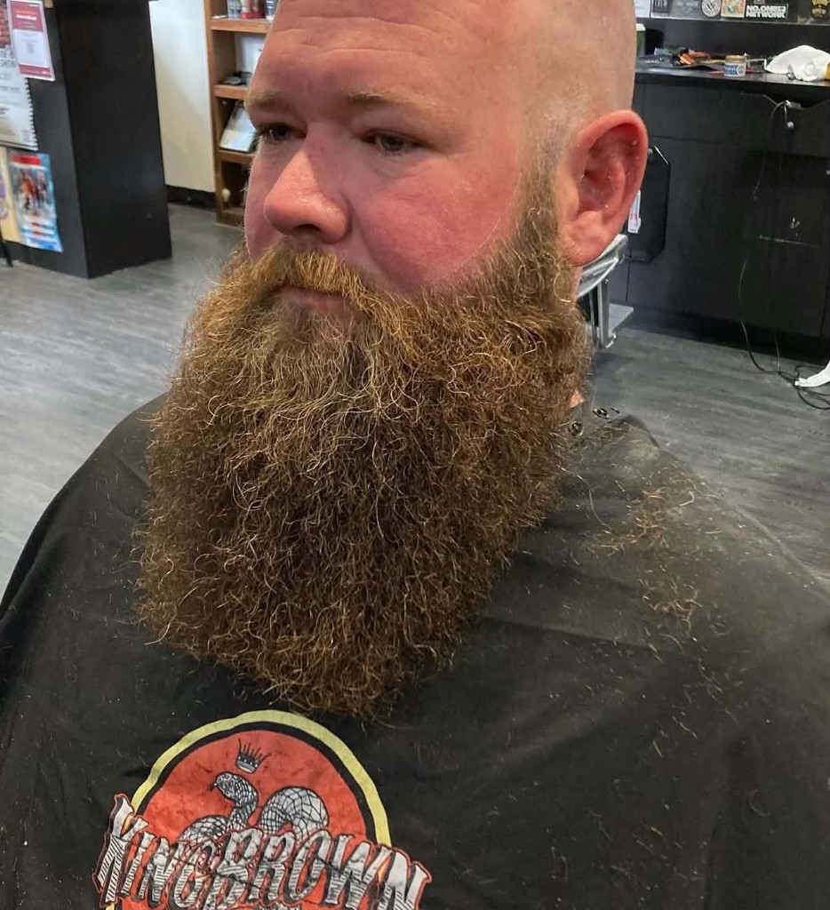Bald head and full beard, three-quarter view